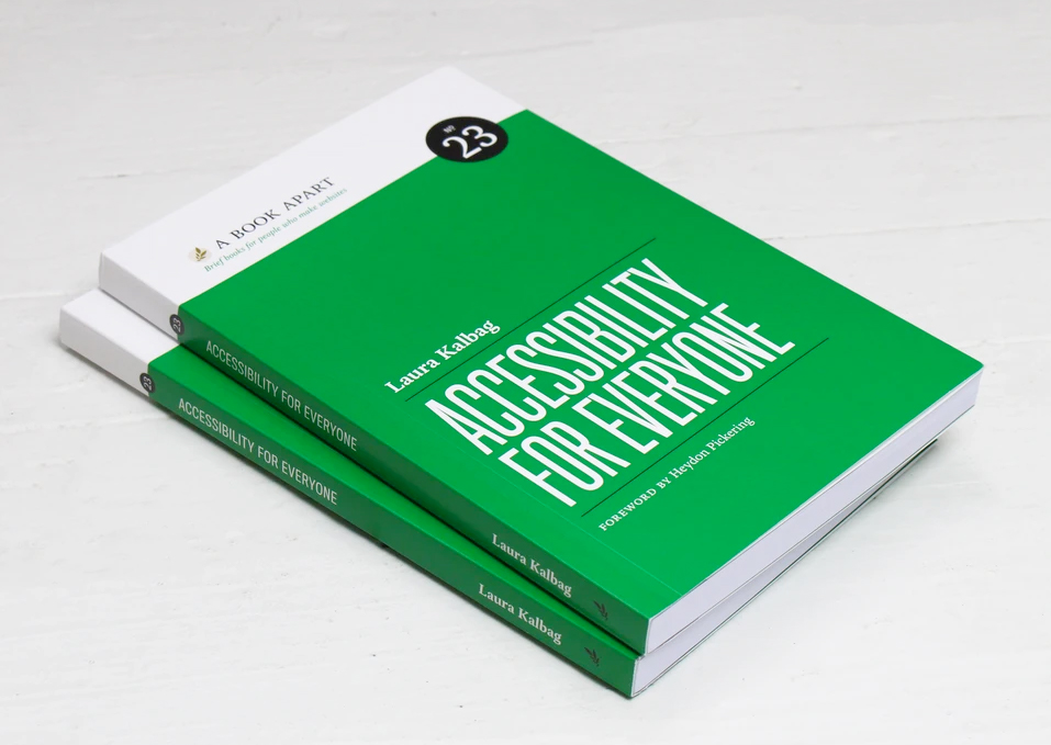 Two stacked copies of the book, Accessibility for Everyone.